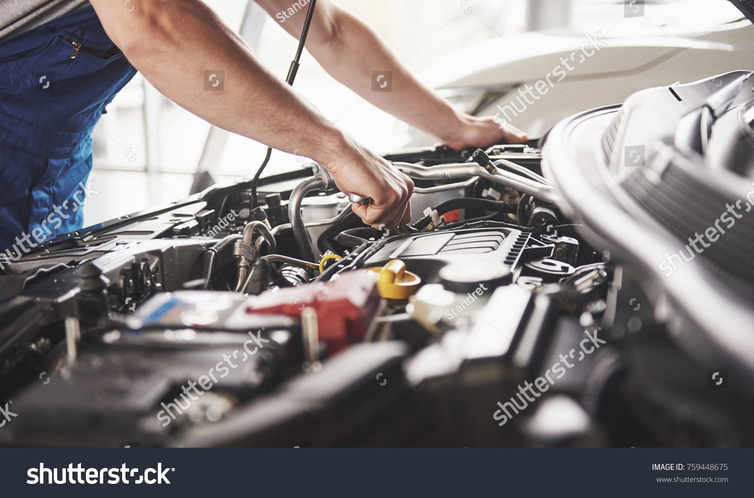 stock-photo-auto-mechanic-working-in-garage-repair-service-759448675.jpg