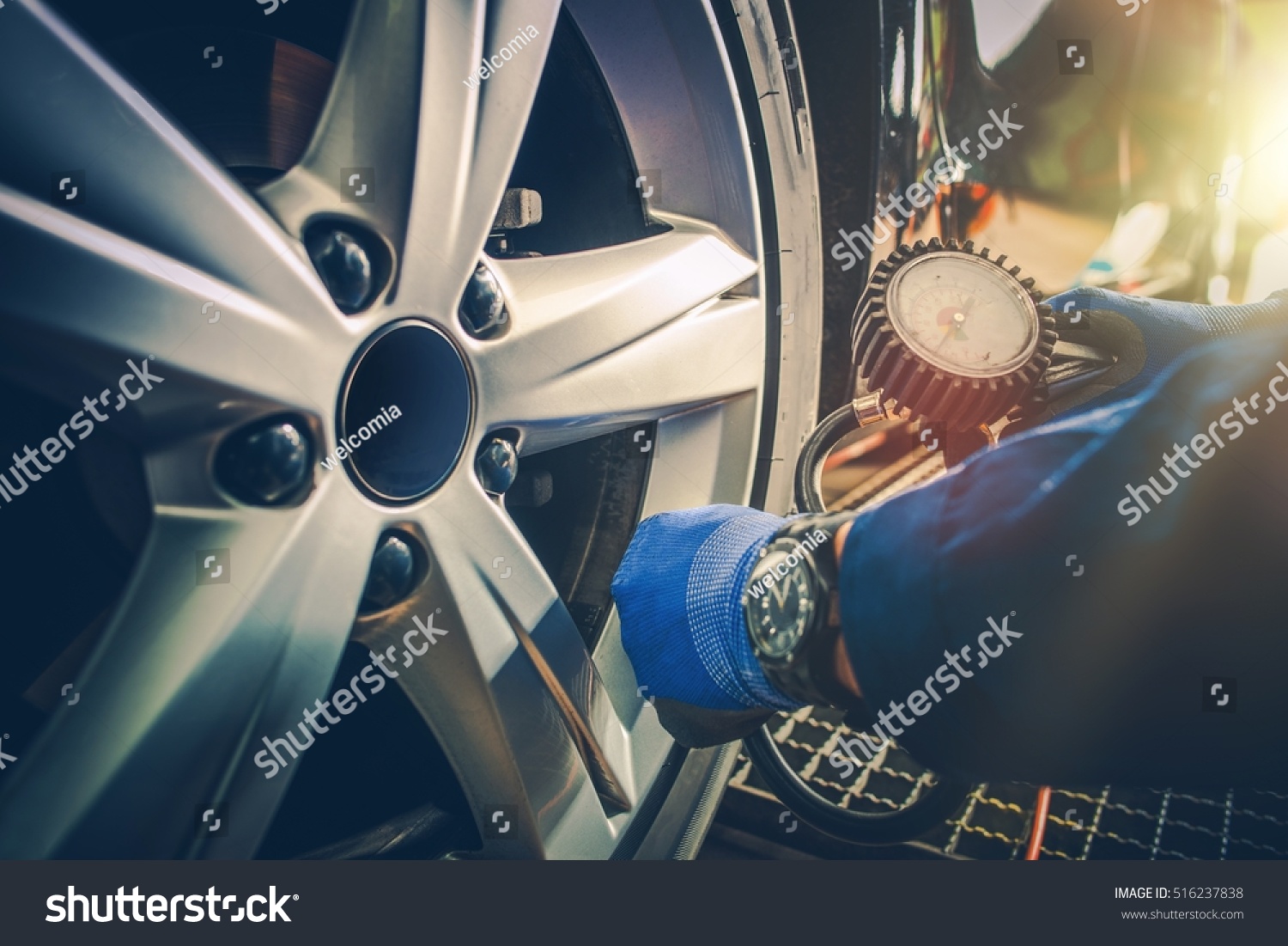 stock-photo-car-tire-pressure-check-in-the-auto-service-garage-516237838.jpg